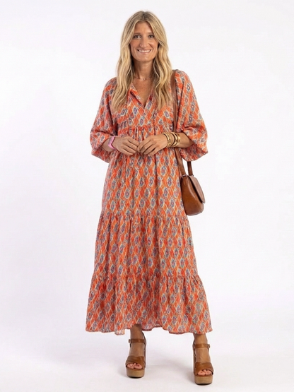 Chiara | Vestido midi estampado geométrico con cuello en v y capas