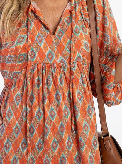 Chiara | Vestido midi estampado geométrico con cuello en v y capas